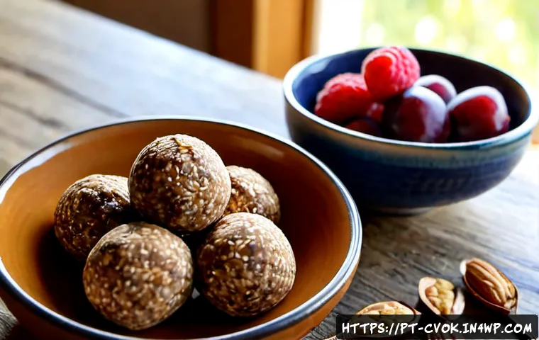 대체 단백질을 활용한 건강한 에너지 볼 만들기 - Photorealistic close-up of homemade healthy energy balls made with plant-based protein, oats, dates,...